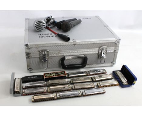 A group of harmonicas including Hohner Marine Band and Blues Harp (some boxed), two harmonica microphones including Shure 520