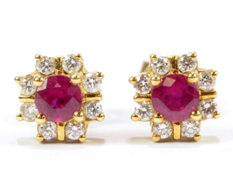 A pair of 18ct yellow gold diamond and ruby floral ear studs, diameter approx 7mm, approx 2.8g. CONDITION REPORT: Appears goo