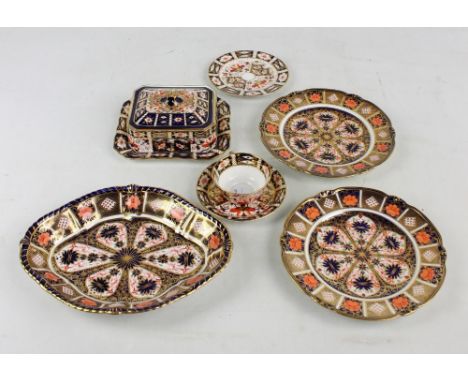 A group of Royal Crown Derby Imari pattern decorated items, comprising an oval shaped bowl, a pair of plates, diameter 23cm, 