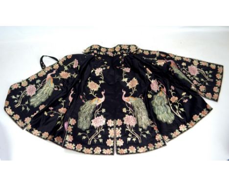 A Chinese black silk jacket with peacock and peony decoration, length 60cm. CONDITION REPORT: Some fraying to the collar. Gen