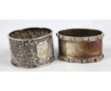 An Elizabeth II hallmarked silver oval napkin ring with Celtic band decoration, maker's mark illegible, Birmingham 1958, and 