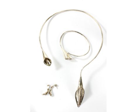 KAREN FAULKNER-DUNKLEY; a sterling silver suite, 'The Lily Collection', comprising Lily Torque, bangle and drop earrings, com