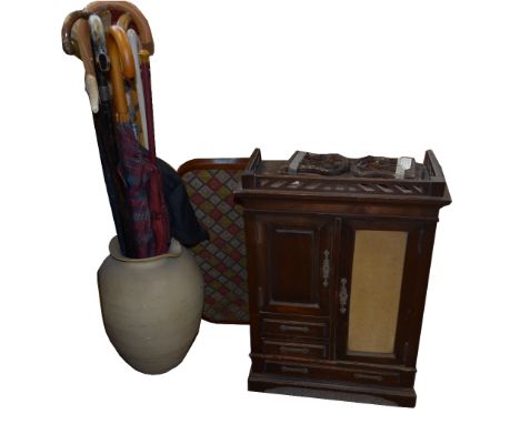 A mixed lot comprising an early 20th century apprentice wardrobe, a Victorian tray with embroidered top, a carved book slide 