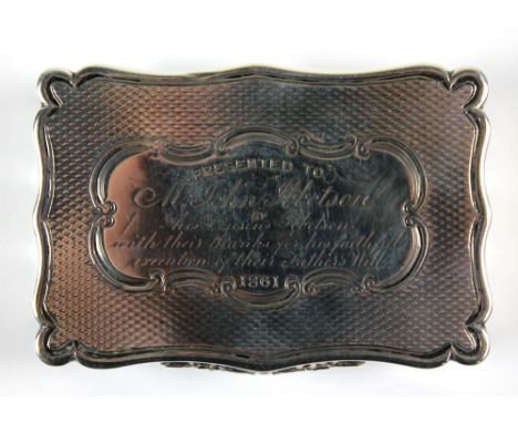 EDWARD SMITH; a Victorian hallmarked silver shaped rectangular snuff box with overall engine turned decoration and foliate sc