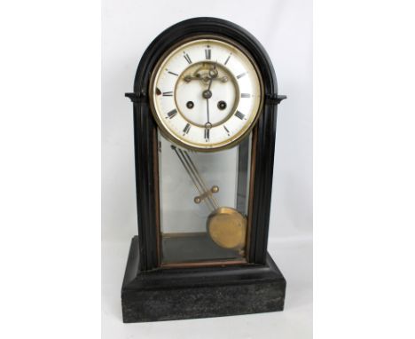 A late 19th century French black slate and glass eight day mantel clock, with two-piece white enamel dial, slow/fast setting 