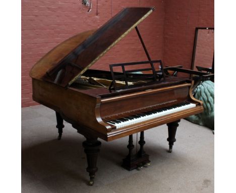 BLUTHNER; a rosewood grand piano no.82577 raised on ring turned tapering legs, length 175cm.