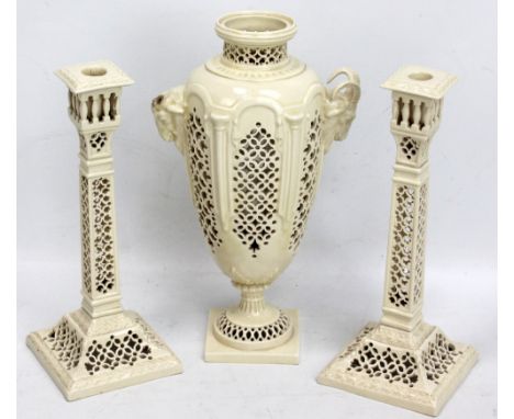 A Leeds pottery three piece garniture comprising a footed ovoid reticulated vase with ram head handles, height 27cm (lacking 