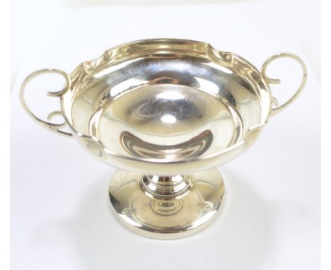 J &amp; R GRIFFIN LTD; a George V hallmarked silver twin handled pedestal bowl on waisted foot and circular loaded base, Ches