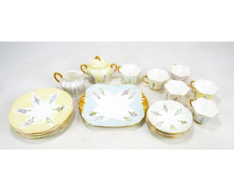 SHELLEY; a circa 1950s 'Dainty' pattern harlequin floral decorated six setting tea service comprising tea trios, milk jug, su