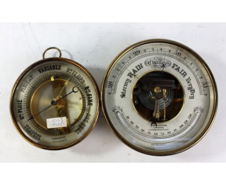 A brass cased Barometre Métallique, diameter 17cm, and a brass cased barometer with thermometer, inscribed 'Curry &amp; Paxto