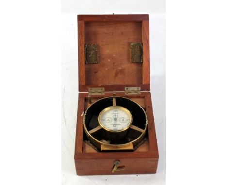 A mahogany cased brass anemometer, with four 'blades' and central dial inscribed 'Velocity in Feet', high speed no.1305, 11.5