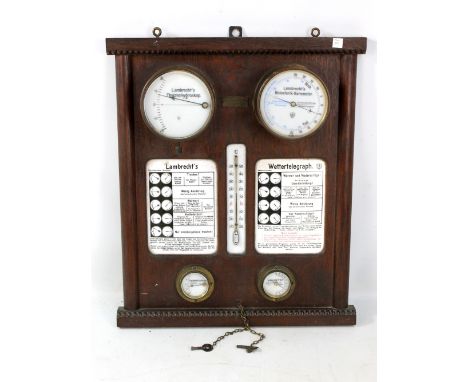An oak cased 'Lambrecht's Wettertelegraph' set with thermohygroskop and holosterik barometer to the upper portion, central th