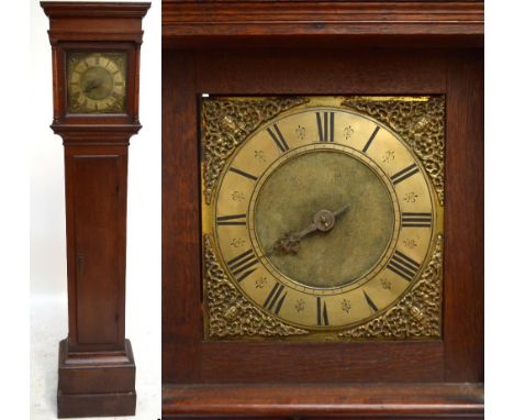 An early 18th century oak longcase clock, the moulded cornice above a 9 3/4" square brass dial, with single hand and thirty h