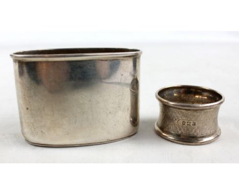 A hallmarked silver napkin ring and hip flask cup, combined approx 2.7ozt (2).