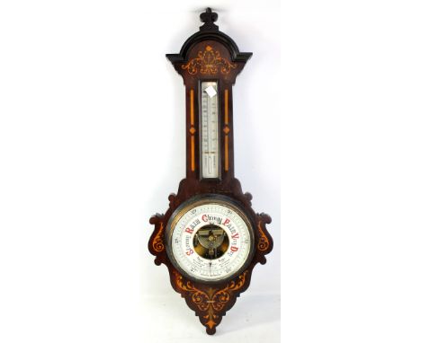 An Edwardian mahogany and inlaid aneroid wheel barometer with thermometer dial above barometer dial inscribed 'James Lucking 