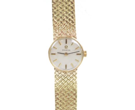 OMEGA; a 9ct yellow gold manual wind lady's wristwatch, the circular dial set with baton numerals, diameter 2cm, on integral 