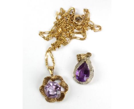 A 9ct yellow gold pendant set with central round cut amethyst suspended on a 9ct yellow gold chain and a further 9ct yellow g