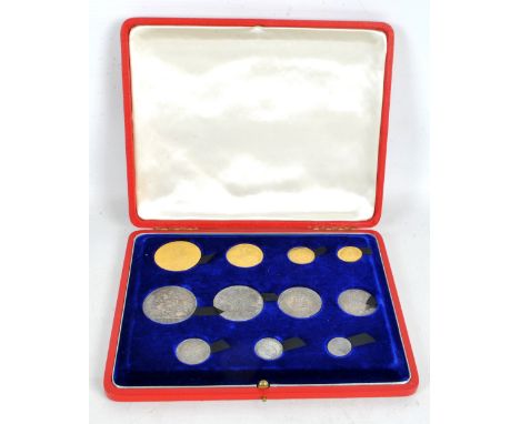 A cased Victorian eleven coin set comprising gold £5 coin, double sovereign, sovereign and half sovereign, silver crown, half