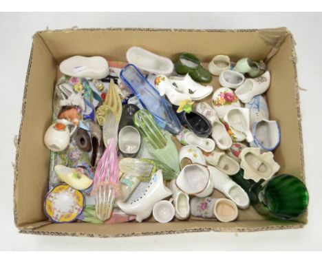 A small collection of various ceramic shoes including crested ware and 'Cottage Rose' pattern decorated examples, and Murano 