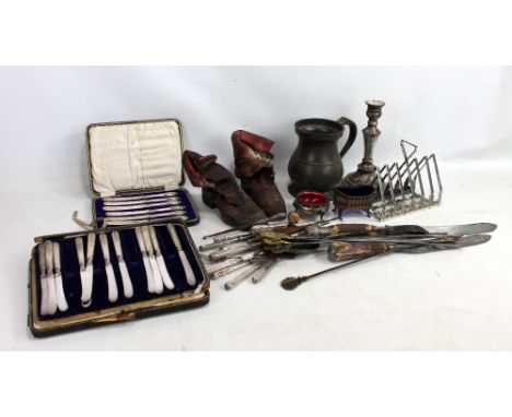 A mixed lot of metalware including silver handled flatware, antler handled carving set, pewter mug, silver plated toast rack 