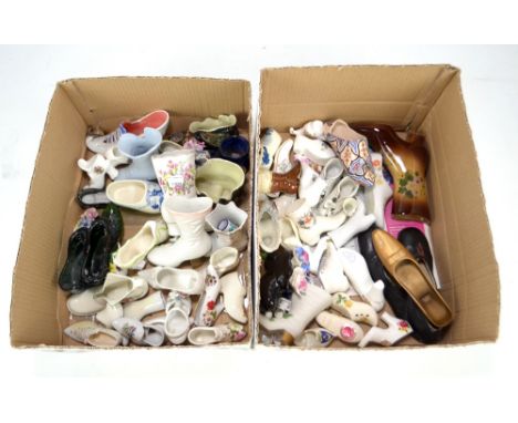 A collection of various predominantly ceramic shoes including Coalport 'Ming Rose', and crested ware examples, also a pair of