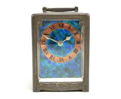 LIBERTY &amp; CO; a Tudric pewter timepiece in the style of Archibald Knox (1864 -1933), the blue and green rectangular ename