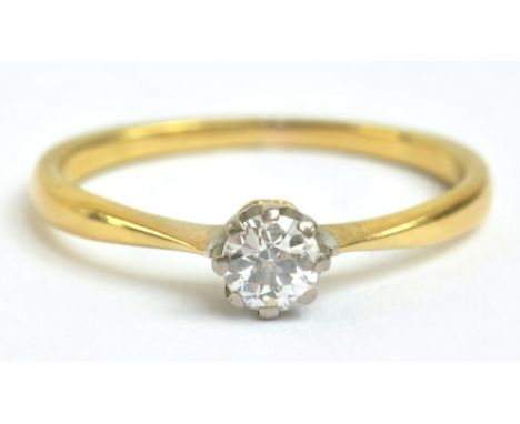 A yellow metal and diamond solitaire ring, the diamond weighing approx 0.20cts, size M, approx 2g.