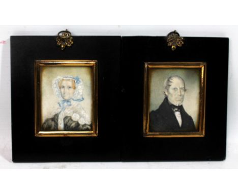 A pair of 19th century ivory portrait miniatures depicting a lady in a bonnet and a gentleman respectively, each 7.5 x 5.5cm 