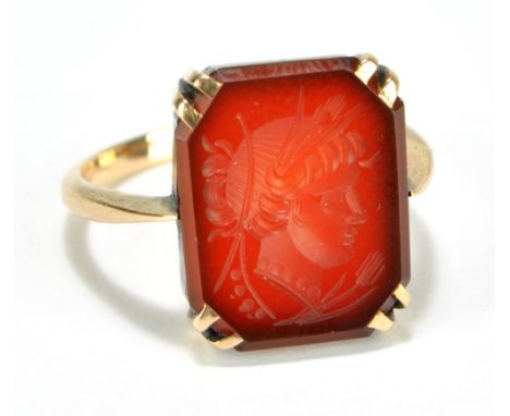 A 19th century yellow metal and carnelian ring engraved with portrait of a young man, size N 1/2, approx 3.5g. CONDITION REPO