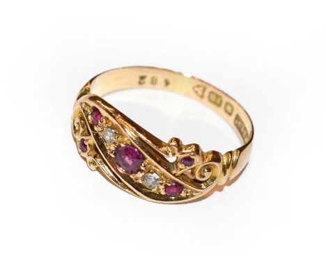 An 18 carat gold ruby and diamond ring, finger size L.  Gross weight 2.6 grams. 