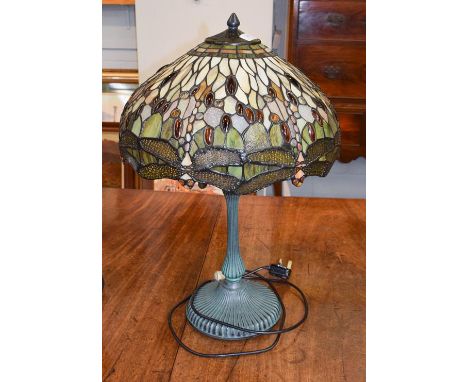 A Tiffany style table lamp, the shade decorated with dragon flies and cabouchons, 61cm .   (in good condition) 