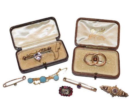 A 9 carat gold ruby and split pearl brooch, length 4.1cm; a garnet mourning brooch, length 1.9cm; two brooches stamped '9CT';