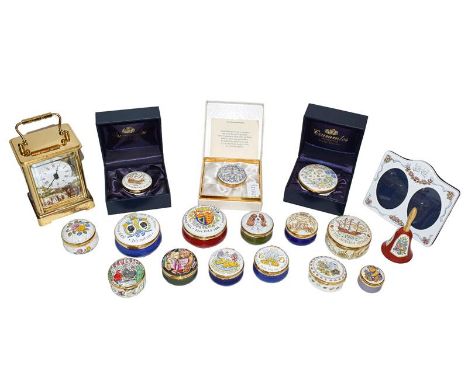 Fifteen Crummels enamel trinket boxes, a similar bell, a twin porcelian picture frame and a carriage timepiece