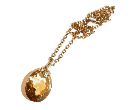 A citrine and split pearl pendant on chain, pendant length 3.5cm, chain length 38cm .  Chain with applied plaque stamped '9C'