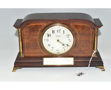 A MAHOGANY MANTEL CLOCK, an eight day Georgian style clock supported by four gilt metal feet, with two supporting columns and