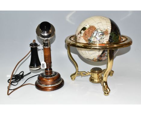 A PIETRA DURA SEMI PRECIOUS GEMSTONE GLOBE, mounted in a brass stand with a compass in the base, together with a modern novel