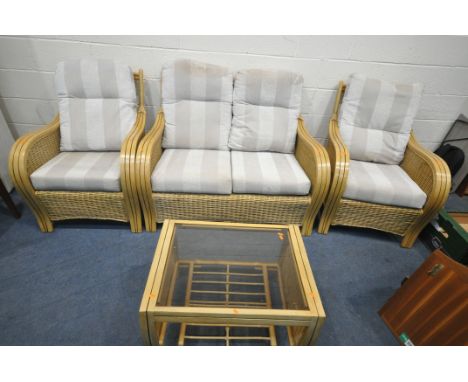 A RATTAN FOUR PIECE CONSERVATORY SUITE, comprising a two seater sofa, length 126cm x depth 90cm x height 94cm, a pair of armc