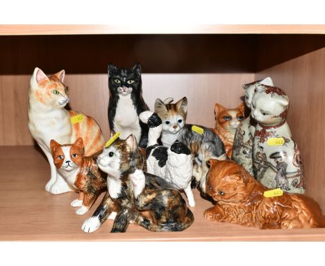 A GROUP OF ELEVEN PORCELAIN CATS to include a pair of satsuma style Japanese cats decorated with court scenes (heavy crazing)