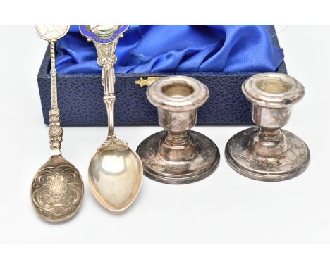 A BOXED PAIR OF SILVER DWARF CANDLESTICKS AND TWO SPOONS, dwarf candlesticks on round weighted bases, hallmarked 'Wilkinson S