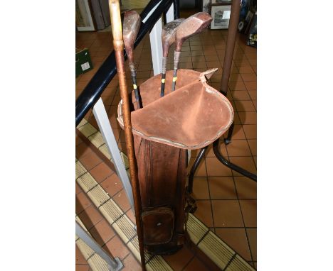 A SET OF THREE VINTAGE GOLF CLUBS, two fairway woods with metal shafts and one driver made in Scotland by Gibson of Kinghorn 
