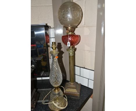 TWO TABLE LAMPS comprising a Duplex paraffin oil lamp on a Corinthian stand height 85cm and a crystal cut and brass lamp heig