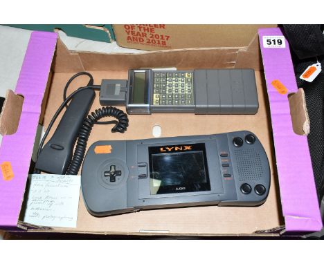 AN UNBOXED ATARI LYNX HANDHELD GAMES CONSOLE, not tested, appears complete and in fairly good condition, no games, cables or 