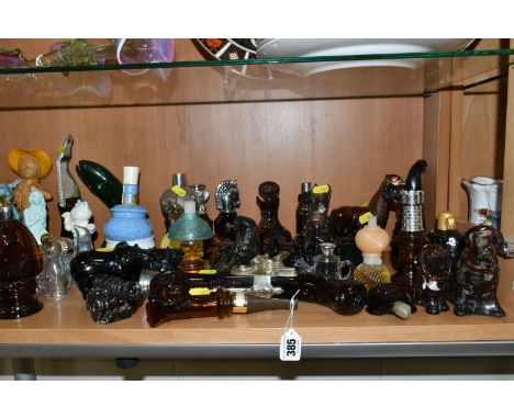 A COLLECTION OF AVON COSMETICS AND SIMILAR BOTTLES, approximately forty bottles, in forms to include vehicles, dogs, a fish, 