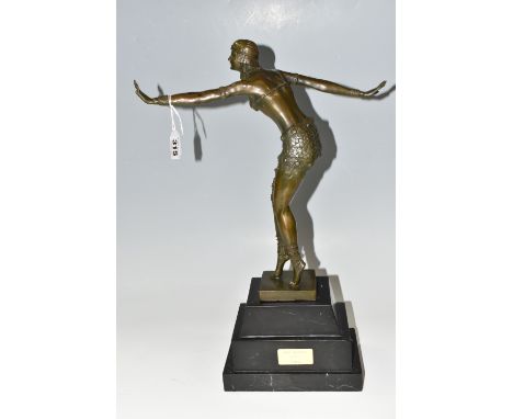 A BRONZE ART DECO SCULPTURE OF A CHARLESTON DANCING FIGURE, mounted on a stepped marble plinth, height 50cm, a small gilt pla