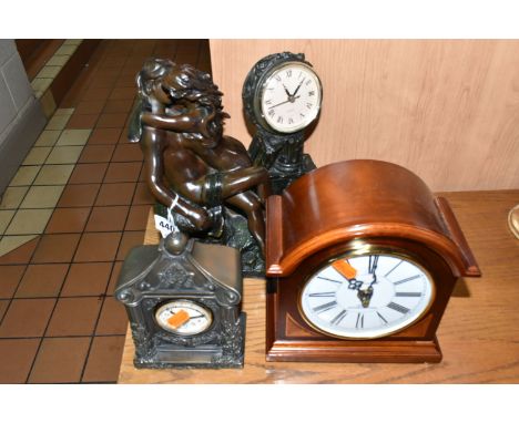 A GROUP OF THREE CLOCKS, all battery powered, one Churchill mantel clock height 22cm x width 20cm, one figurative wood and co