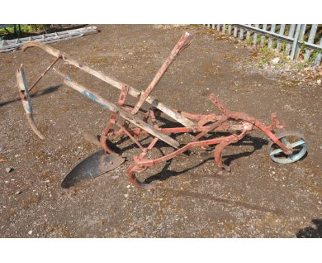A VINTAGE HORSE DRAWN PLOUGH with wrought and cast iron construction (condition report: wooden parts decayed, missing or brok