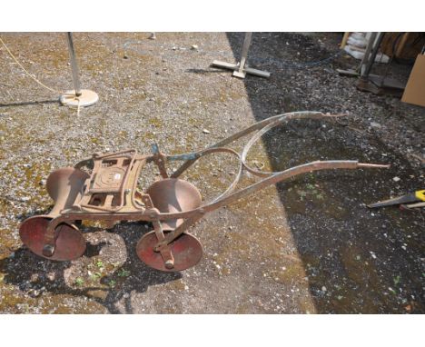 A VINTAGE RICHMOND AND CHANDLER TURNIP SOWER cast iron in construction embossed with SD55 (condition report: rusted and seize