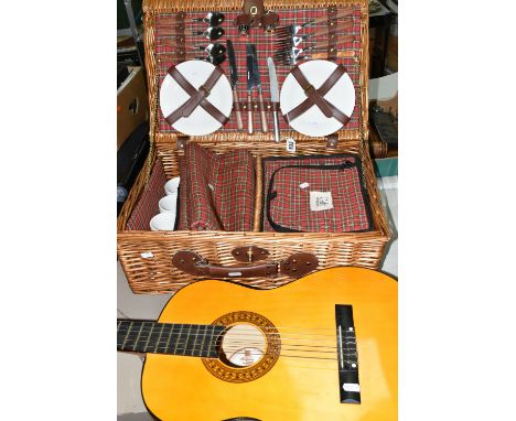 A GIFT COMPANY PICNIC HAMPER AND AN ACOUSTIC GUITAR, comprising a Herald HLD006 full size classic guitar, together with a Gif