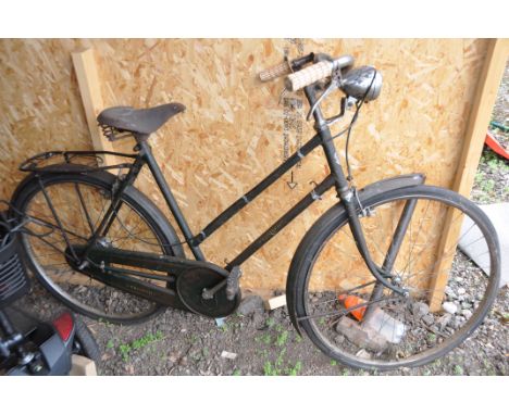 A VINTAGE TRIUMPH GREEN LADIES BIKE with a Brooks leather saddle and 21in frame
