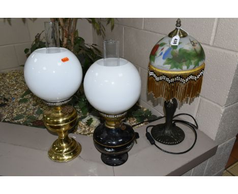 A GROUP OF THREE LAMPS to include a Duplex paraffin lamp, a Gemine paraffin lamp with a black glass base, a reproduction art 